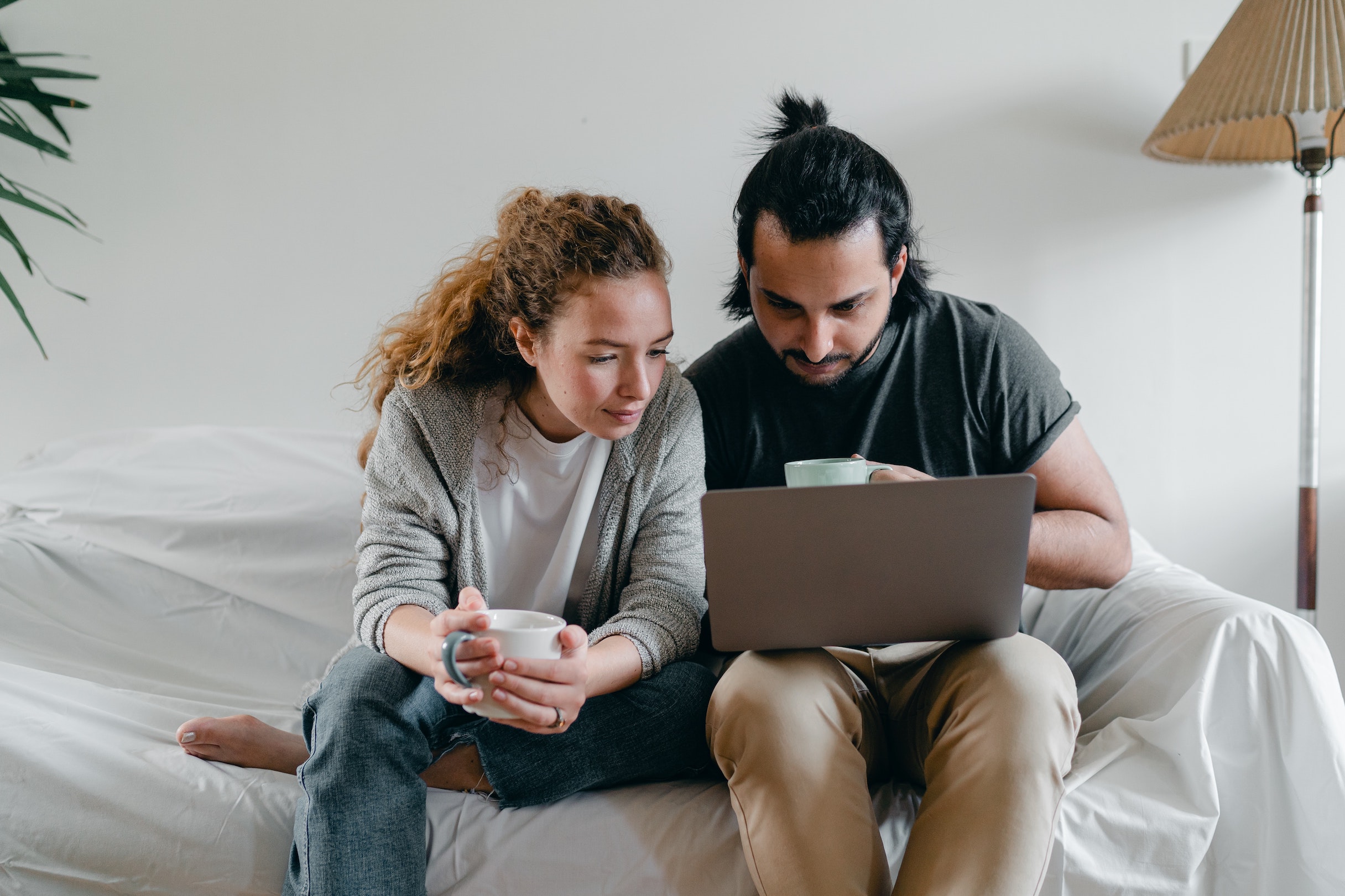 A couple using a laptop